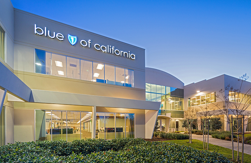 3300 Zinfandel exterior at dusk building entrance